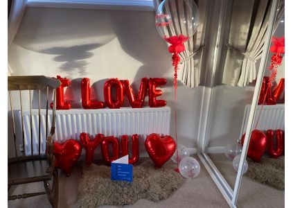 Customer image of Personalised Red Feathers Bubble Balloon
