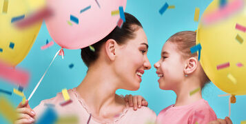 Funny,Family,On,A,Background,Of,Bright,Blue,Wall.,Mother