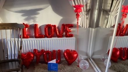 Customer image of Personalised Red Feathers Bubble Balloon